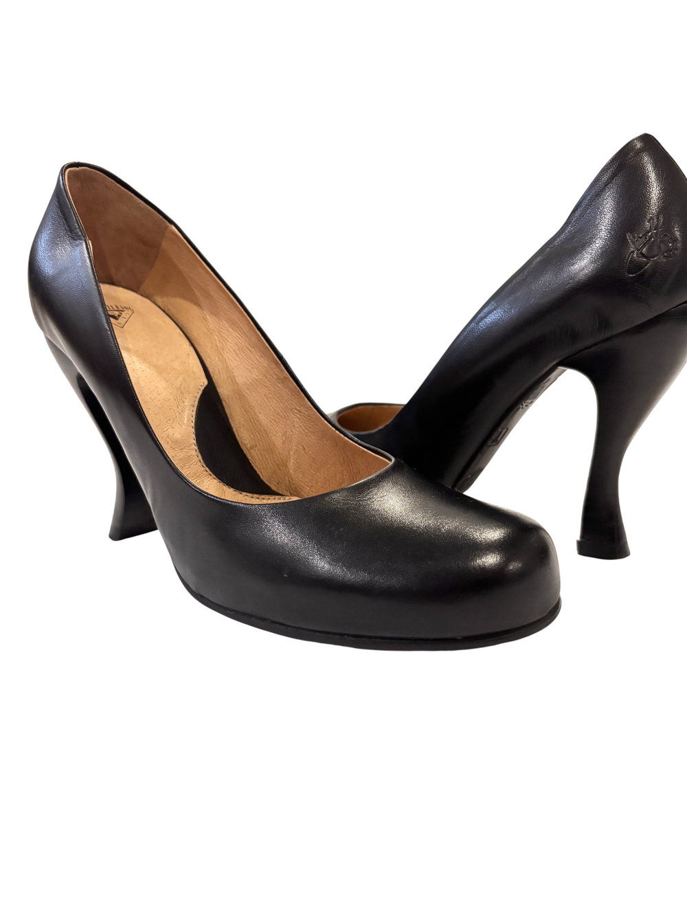 John Fluevog black leather pumps with round toe, slip-on design, flared heel, an